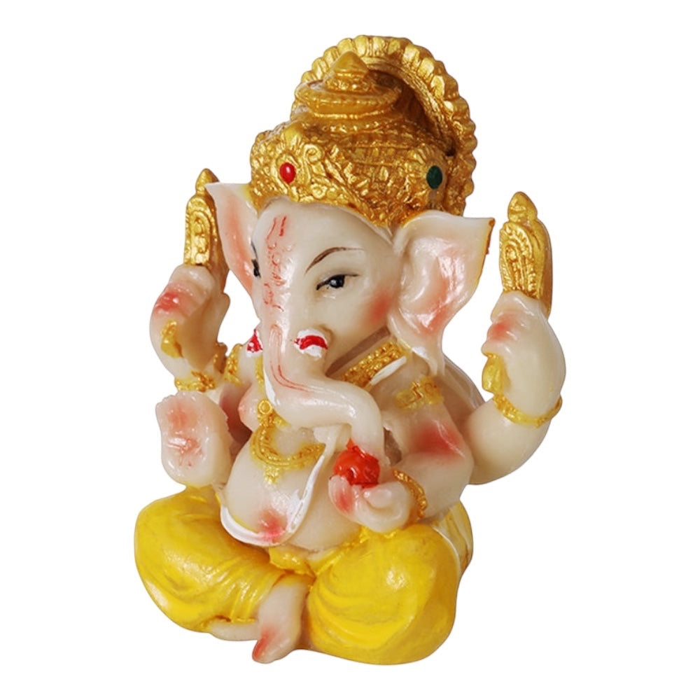 Lord Ganesh statue, 2" glossy finish, seated in yellow robes with gold crown and jewelry.